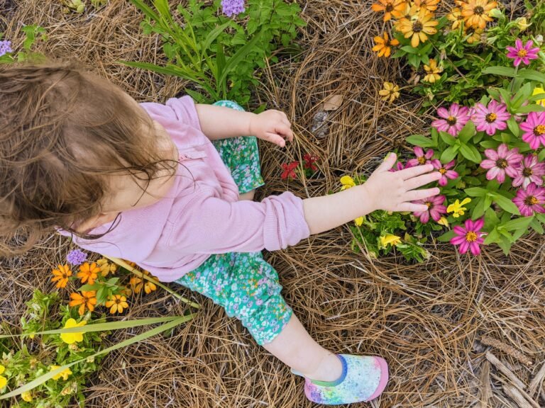A photo of a child gardening