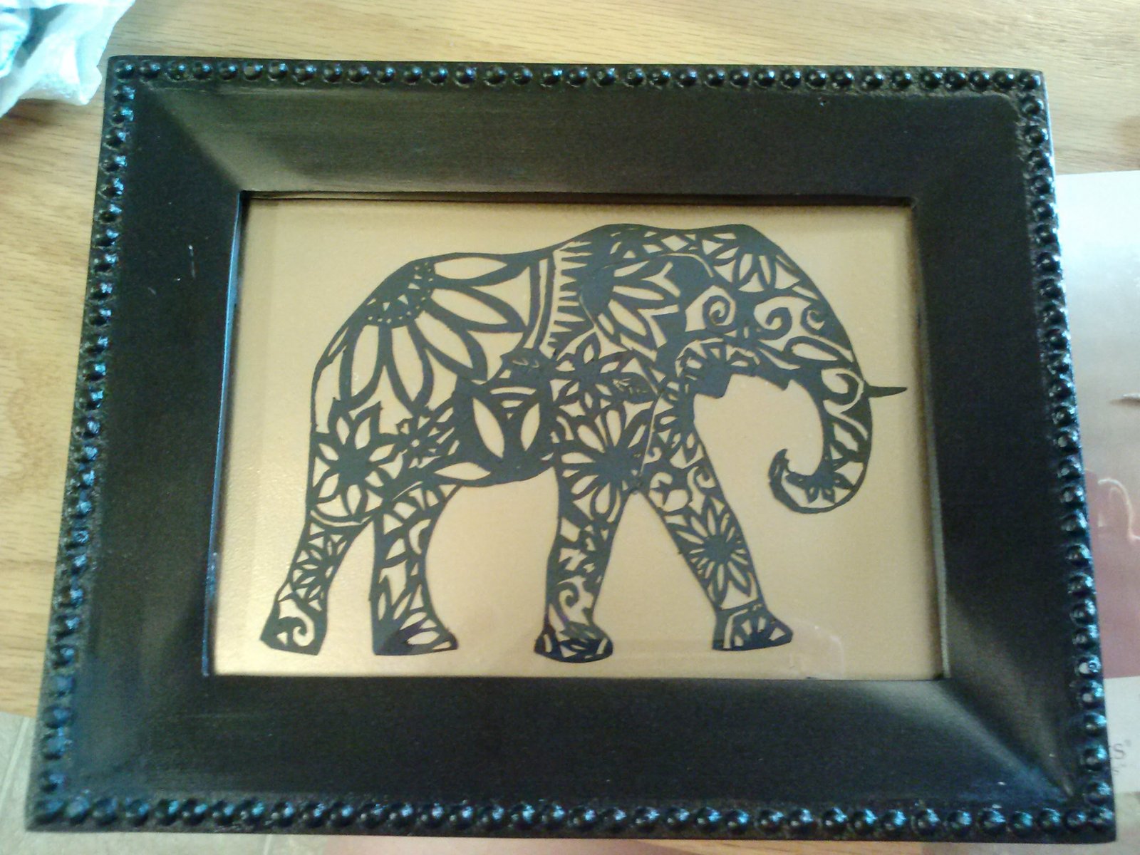 Silhouette Paper art piece showing an ornate elephant