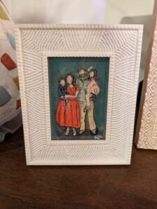 Framed watercolor portrait of a family of 4