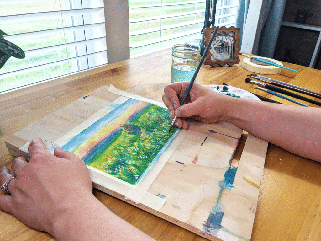 Photo of artist doing watercolor landscape